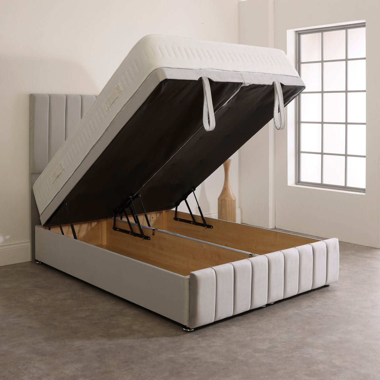 Pembroke Ottoman storage divan bed base with the lid open, showing the storage space inside in beige.